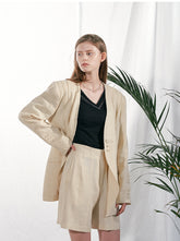 Tailored Linen Blazer with Asymmetric Button Detail and Elongated Silhouette